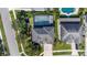 Stunning aerial view of home featuring a screened-in pool, lush landscaping, and proximity to neighborhood pool at 1910 Lake Roberts Landing Dr, Winter Garden, FL 34787