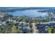 Beautiful aerial view showcasing waterfront community with lake access and several stunning homes at 1910 Lake Roberts Landing Dr, Winter Garden, FL 34787