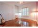 Bedroom with hardwood floors, white walls, and a ceiling fan at 1910 Lake Roberts Landing Dr, Winter Garden, FL 34787