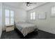 Cozy bedroom with dark hardwood floors and bright natural light at 1910 Lake Roberts Landing Dr, Winter Garden, FL 34787