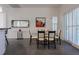 Dining area with modern lighting, glass table, stylish chairs, and tile floors at 1910 Lake Roberts Landing Dr, Winter Garden, FL 34787