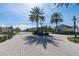 Gated entrance to a neighborhood featuring brick-paved streets and beautifully maintained landscaping at 1910 Lake Roberts Landing Dr, Winter Garden, FL 34787