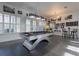 Spacious game room with modern pool table, plantation shutters, and stylish decor at 1910 Lake Roberts Landing Dr, Winter Garden, FL 34787