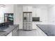 Open kitchen featuring stainless steel fridge and granite countertops at 1910 Lake Roberts Landing Dr, Winter Garden, FL 34787