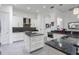 Stylish kitchen featuring granite counters, stainless appliances and white cabinets at 1910 Lake Roberts Landing Dr, Winter Garden, FL 34787