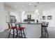 Kitchen featuring a granite island with bar stool seating at 1910 Lake Roberts Landing Dr, Winter Garden, FL 34787