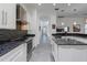 Modern kitchen featuring stainless steel appliances, island, and white cabinets at 1910 Lake Roberts Landing Dr, Winter Garden, FL 34787