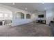 Spacious loft area with carpet and view through large arched windows at 1910 Lake Roberts Landing Dr, Winter Garden, FL 34787