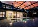 Backyard pool area with an evening sky backdrop featuring ample patio and entertainment space at 1910 Lake Roberts Landing Dr, Winter Garden, FL 34787