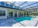 Inviting screened-in pool area with tile decking and spacious outdoor living for relaxation and entertaining at 1910 Lake Roberts Landing Dr, Winter Garden, FL 34787