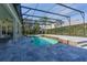 Inviting screened-in pool area with tile decking and spacious outdoor living for relaxation and entertaining at 1910 Lake Roberts Landing Dr, Winter Garden, FL 34787