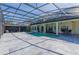 Inviting screened-in pool area with tile decking and spacious outdoor living for relaxation and entertaining at 1910 Lake Roberts Landing Dr, Winter Garden, FL 34787