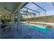 Inviting screened-in pool area with tile decking and spacious outdoor living for relaxation and entertaining at 1910 Lake Roberts Landing Dr, Winter Garden, FL 34787