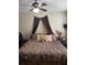 Comfortable bedroom with a ceiling fan, neutral walls, and inviting bedding at 1997 Dixie Belle Dr # 1997C, Orlando, FL 32812