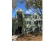 Inviting exterior view of a charming condominium building with well-maintained landscaping at 1997 Dixie Belle Dr # 1997C, Orlando, FL 32812