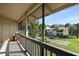 Inviting screened balcony offering serene views of the manicured lawn, mature trees, and neighboring residences at 200 Maitland Ave # 96, Altamonte Springs, FL 32701