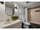 Well-lit bathroom with modern vanity, patterned shower curtain, and decorative plants at 200 Maitland Ave # 96, Altamonte Springs, FL 32701