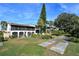 Building exterior view with lawn and community walking paths at 200 Maitland Ave # 96, Altamonte Springs, FL 32701