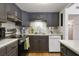 Functional kitchen boasts gray cabinets, stainless steel appliances, and ample counter space for meal preparation at 200 Maitland Ave # 96, Altamonte Springs, FL 32701