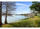 Relaxing lake view with grassy shore and shade trees at 200 Maitland Ave # 96, Altamonte Springs, FL 32701