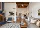 A living room featuring vaulted wood ceilings and a cozy fireplace at 200 Maitland Ave # 96, Altamonte Springs, FL 32701