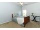 Cozy bedroom features carpet floors, a ceiling fan, and a side table with flowers at 2165 Westbourne Dr, Oviedo, FL 32765