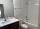 Cozy bathroom with shower-tub combination, single sink, and a large mirror above the counter at 2205 W Lobelia Dr, Lake Mary, FL 32746