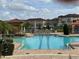 Sparkling community pool with lounge chairs and lush landscaping at 2205 W Lobelia Dr, Lake Mary, FL 32746