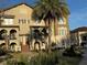 Charming townhouse featuring an attractive facade with multiple windows and a well-maintained landscaped yard at 2205 W Lobelia Dr, Lake Mary, FL 32746