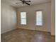Bright living room features neutral walls, tiled floors, and a sliding door to outside at 2205 W Lobelia Dr, Lake Mary, FL 32746