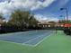 Well-maintained tennis court with green and blue surface, ready for a match at 2205 W Lobelia Dr, Lake Mary, FL 32746