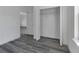 Bedroom featuring closet space and gray flooring, providing a modern and neutral style at 2409 Sw 170Th Pl, Ocala, FL 34473