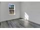 Well-lit bedroom with sleek gray flooring, providing a warm and inviting atmosphere at 2409 Sw 170Th Pl, Ocala, FL 34473
