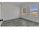 Charming bedroom with sleek gray flooring, and two large windows offering plenty of sunlight at 2409 Sw 170Th Pl, Ocala, FL 34473