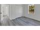 Bedroom featuring closet space and gray flooring, providing a modern and neutral style at 2409 Sw 170Th Pl, Ocala, FL 34473