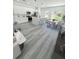 Spacious kitchen with modern appliances, an island with bar seating, and an adjacent dining area at 2409 Sw 170Th Pl, Ocala, FL 34473