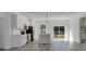 Modern kitchen with white cabinets, an island, and stainless steel appliances at 2409 Sw 170Th Pl, Ocala, FL 34473