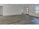 Open-concept living area with gray flooring, natural light, and neutral color palette at 2409 Sw 170Th Pl, Ocala, FL 34473