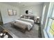 Inviting main bedroom featuring a queen-sized bed, side tables with lamps, and modern decor at 2409 Sw 170Th Pl, Ocala, FL 34473