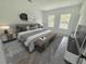 Cozy main bedroom with a comfortable bed, stylish decor, and lots of natural light at 2409 Sw 170Th Pl, Ocala, FL 34473