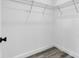 A well-lit walk-in closet features sturdy wire shelving and modern flooring at 2409 Sw 170Th Pl, Ocala, FL 34473