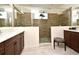 Elegant bathroom with a frameless shower, brown vanity, and white quartz countertops at 2659 Magpie Way, Sanford, FL 32773