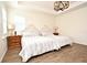 Inviting bedroom features wood-look floors, tray ceilings, plantation shutters and lots of space at 2659 Magpie Way, Sanford, FL 32773