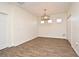 Bright, airy dining room with tile floors, ample natural light, and a stylish chandelier creating an inviting atmosphere at 2659 Magpie Way, Sanford, FL 32773