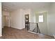 Upstairs hallway featuring wood-look floors, and modern railings creating a bright and inviting living space at 2659 Magpie Way, Sanford, FL 32773