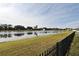 Scenic view of a tranquil lake with a fountain from the backyard at 2659 Magpie Way, Sanford, FL 32773