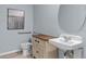 Charming bathroom with a unique vanity, featuring a stylish mirror, and a commode, exuding a cozy ambiance at 2940 Moulin Rd, Davenport, FL 33837