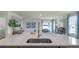 Modern kitchen with stainless steel sink and faucet, offering a seamless blend of style and functionality at 2940 Moulin Rd, Davenport, FL 33837