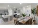 Modern kitchen with stainless steel appliances, quartz countertops, and an island with seating, great for entertaining at 2940 Moulin Rd, Davenport, FL 33837