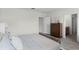Comfortable bedroom with a dresser, ensuite bath, and relaxing decor at 2940 Moulin Rd, Davenport, FL 33837
